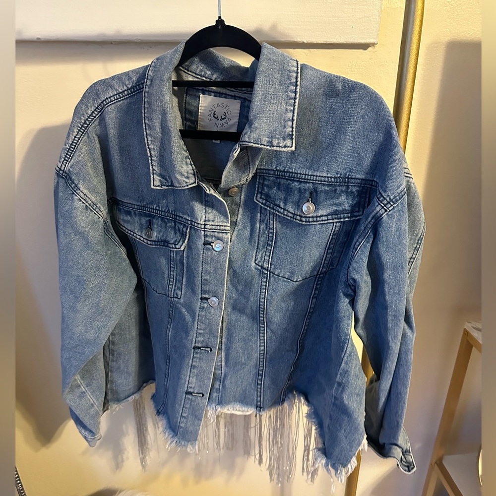 Denim jacket with silver fridge on the back